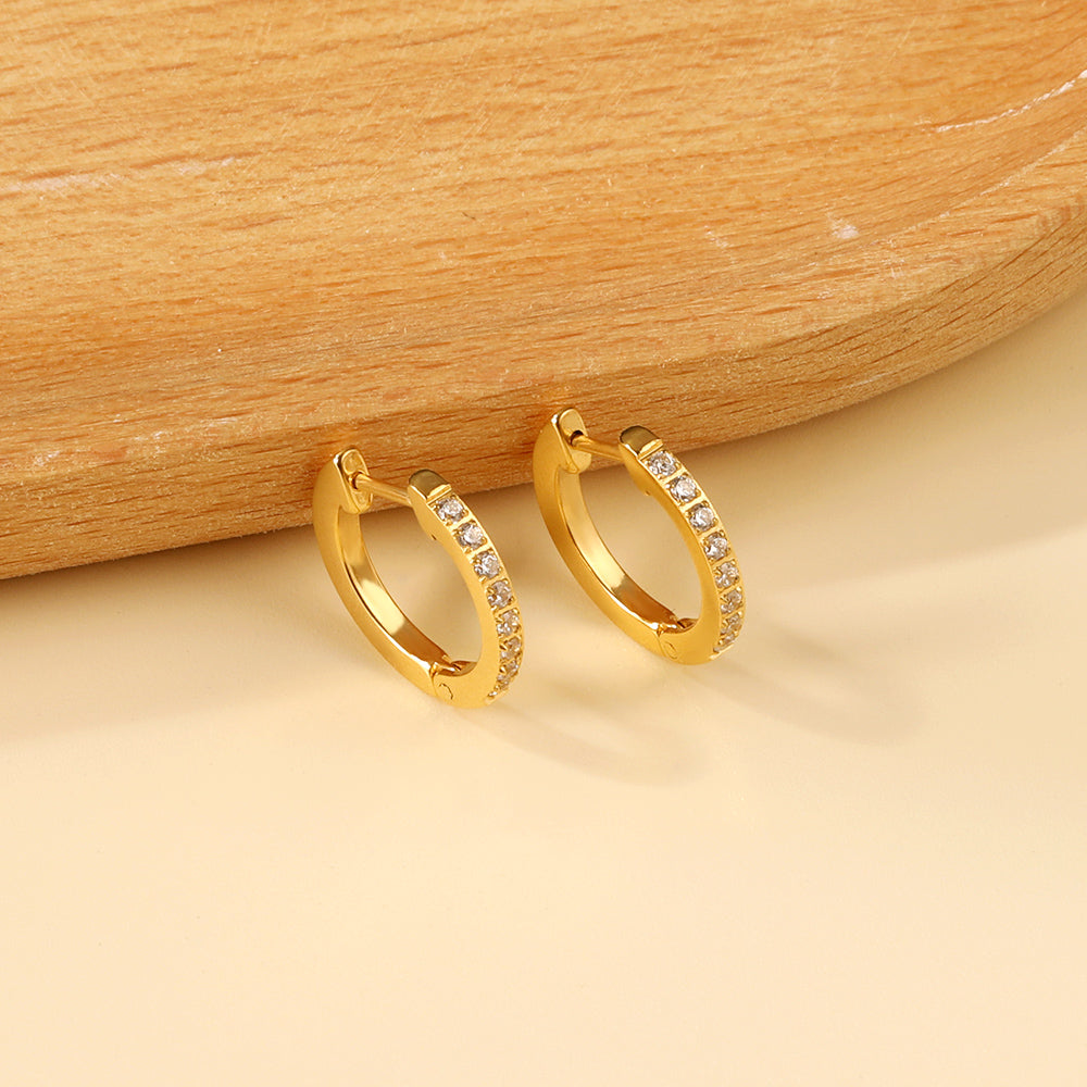 Boucles d'oreilles brillantes rondes dorée