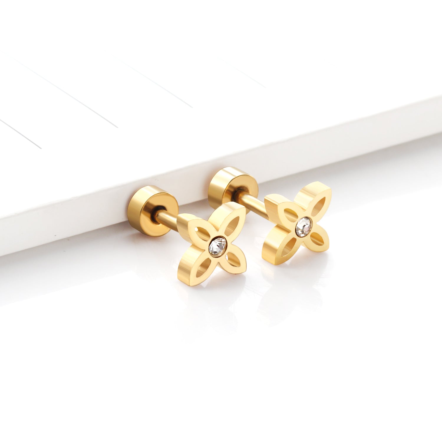 Boucles d'oreilles X dorée