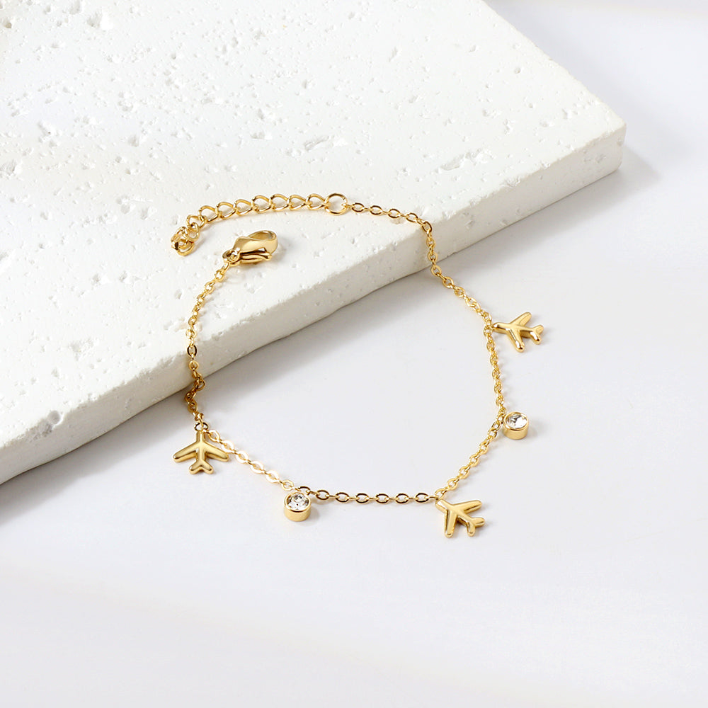Bracelet voyage charms dorée